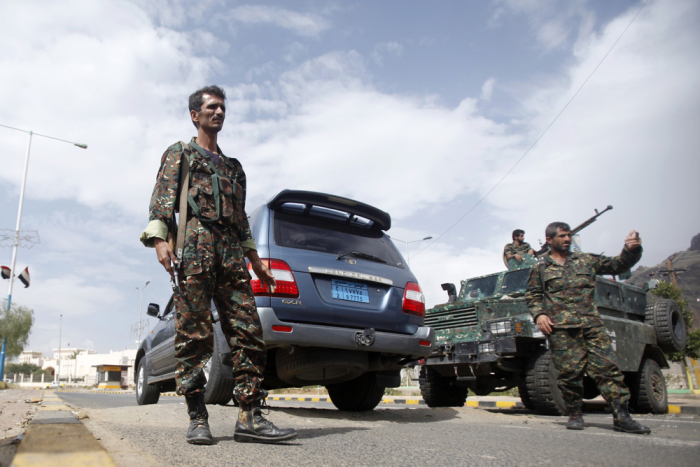 Police troopers man a checkpoint in Sanaa, Yemen.