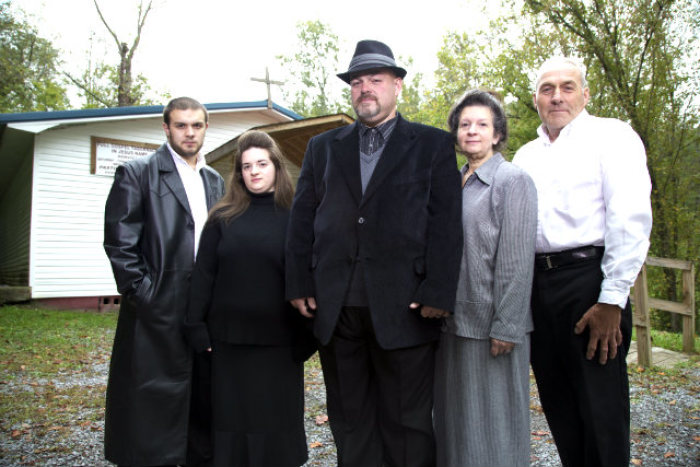 The Coots family stand outside of their church. Pictured is (from left to right) 'Little Cody' Coots, Trina Coots, Jamie Coots, Linda Coots and Greg Coots.