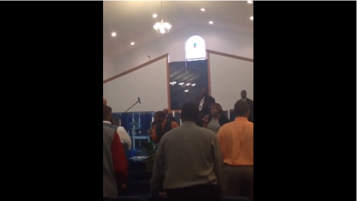 A church choir sings 'Keep Your Business Off Of Facebook'.