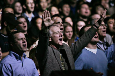 John Piper is seen worshipping in this May 16, 2008, file photo.