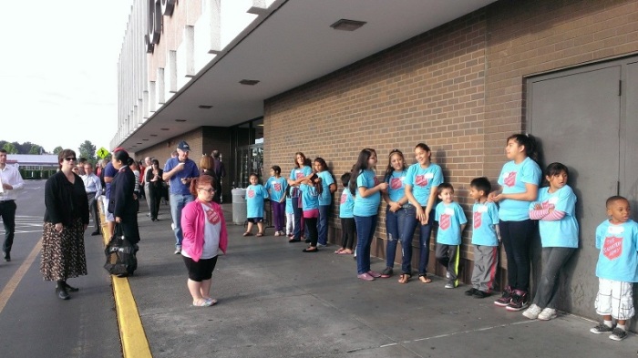 Nearly 100 children wait to participate in back-to-school shopping spree at JC Penny made possible by a Seattle woman who gave ,000 to the Salvation Army for the event, Aug. 20, 2013.