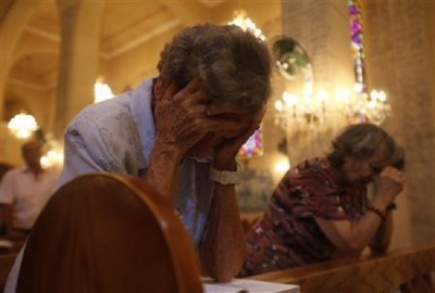 Christians pray in the Basilica of our Lady of Fatima in Cairo in Cairo August 18, 2013.
