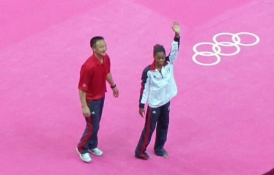 Gymnast Gabby Douglas and coach Liang Chow celebrate Douglas' Olympic all-around gold medal.