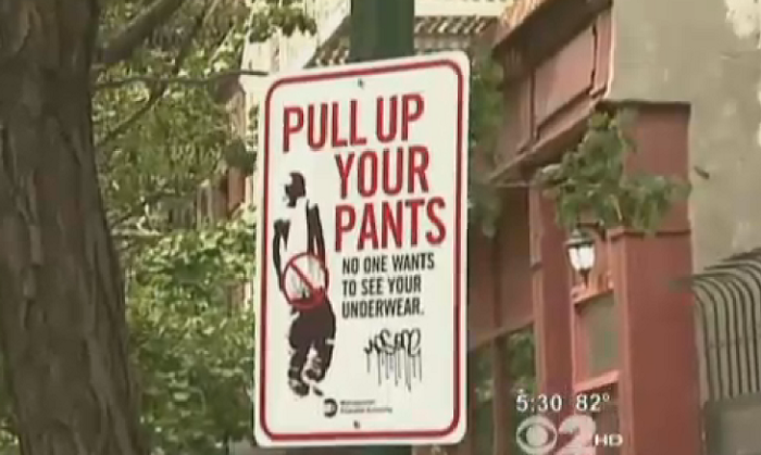 A sign from a campaign in Brooklyn, N.Y. encouraging young men to pull up their pants.