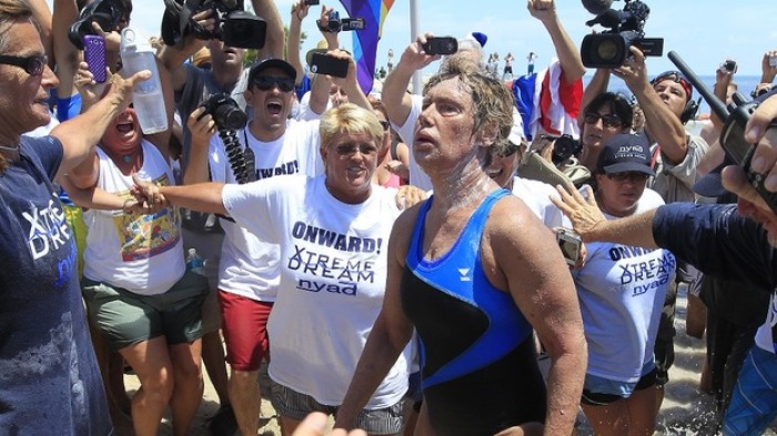 Diana Nyad looks shaky as she makes it to the beach unaided.