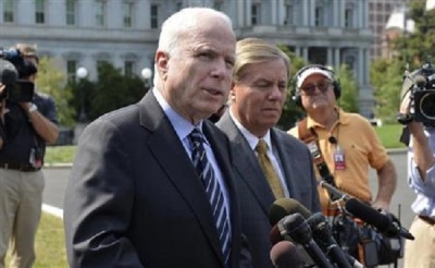 U.S. Senator John McCain (R-AZ), (L), makes remarks to the media as U.S. Senator Lindsey Graham (R-SC) listens, after meeting with U.S. President Barack Obama at the White House, on possible military action against Syria, in Washington September 2, 2013.