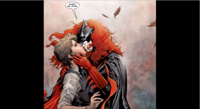 Batwoman kisses her girlfriend.