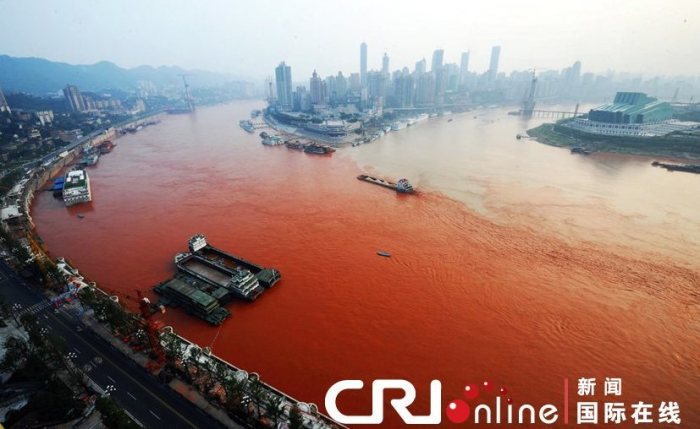 The waters of the Yangtze river near Chongqing municipality in central China have taken on a bright red hue. c