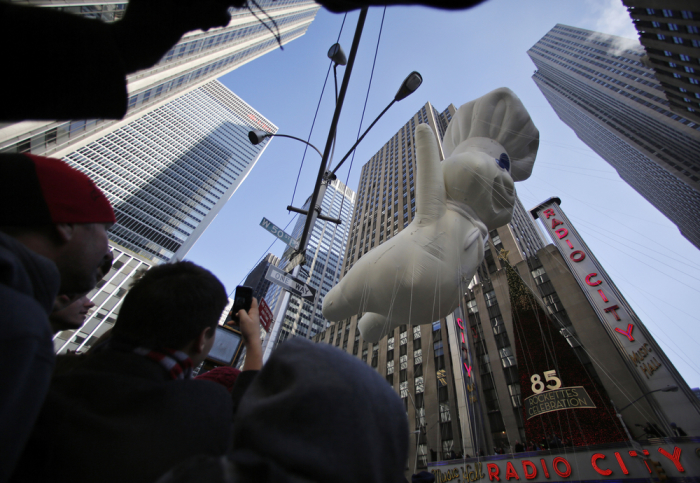 The Pillsbury Doughboy balloon floats past Radio City Music Hall during the 86th Macy's Thanksgiving day parade in New York November 22, 2012.