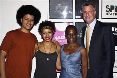 New York City mayoral candidate Bill de Blasio (right), his wife, Chirlane McCray, daughter, Chiara, and son, Dante, pose for a picture as they arrive to speak with supporters at an event in Manhattan, New York, on Aug. 18, 2013.