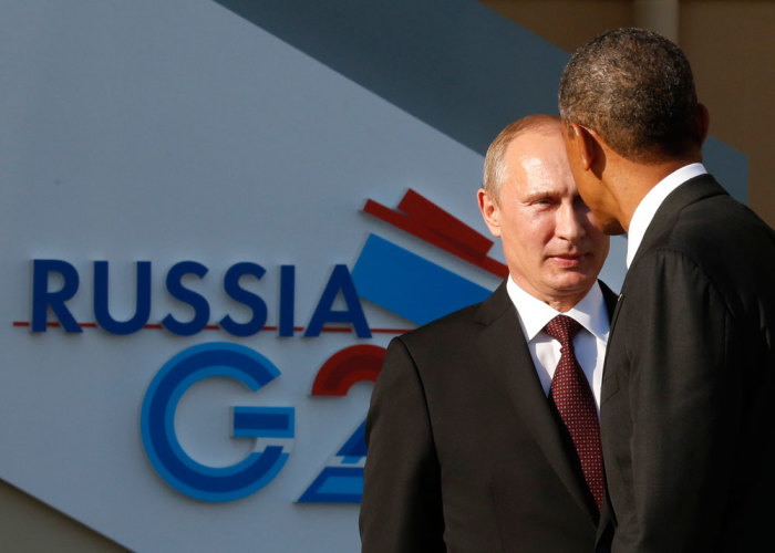 Russia's President Vladimir Putin (L) welcomes U.S. President Barack Obama before the first working session of the G20 Summit in Constantine Palace in Strelna near St. Petersburg, September 5, 2013.
