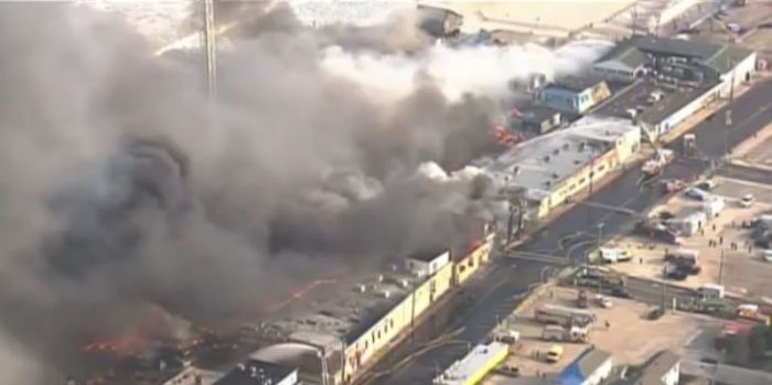 A 6-Alarm fire rages at New Jersey's Seaside Heights Boardwalk. The fire broke out around 2:30 p.m. from inside Khor Brothers Frozen Custard stand.