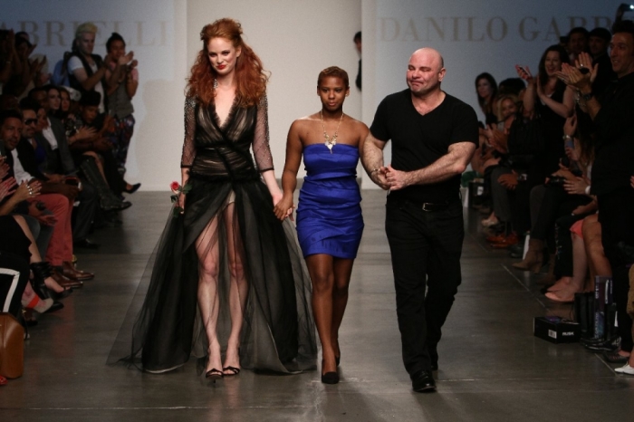 A model walks alongside Danilo and Katherine. Danilo Gabrielli SS14 - NOLCHA FASHION WEEK 2013