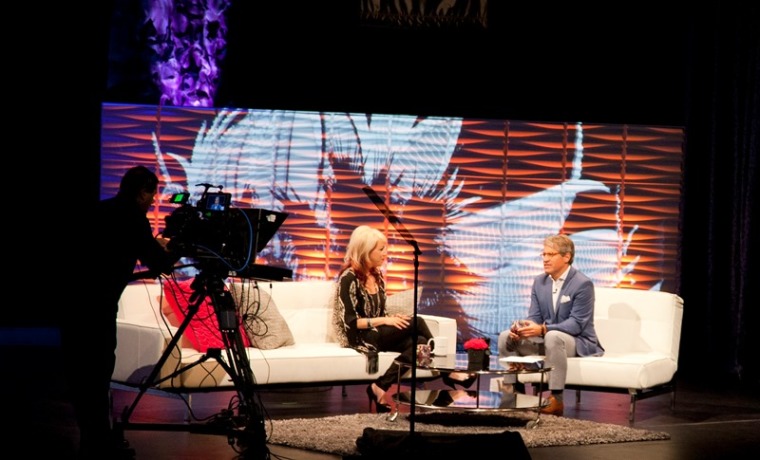 Eric Metaxas, host of 'I Am Second Live' and 100th 'second' interviews Annie Lobert, founder of Hookers for Jesus, at the Dallas City Performance Hall in Dallas, Texas, Sept. 18, 2013.