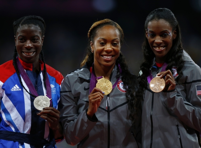 Gold medallist Sanya Richards-Ross of the U.S., silver medallist Britain's Christine Ohuruogu (L) and bronze medallist DeeDee Trotter (R) of the U.S. during the women's 400m victory ceremony at the London 2012 Olympic Games at the Olympic Stadium August 5, 2012.