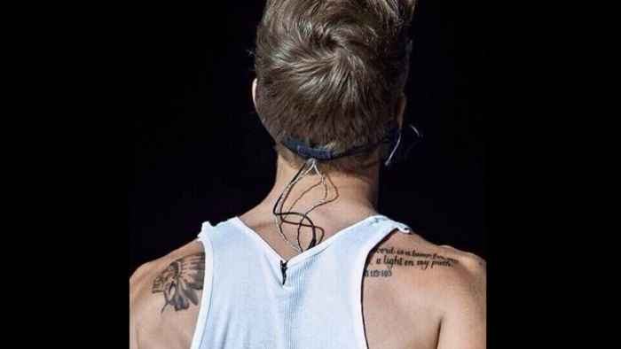 Justin Bieber shows off his new tattoo from the Bible book of Psalm.