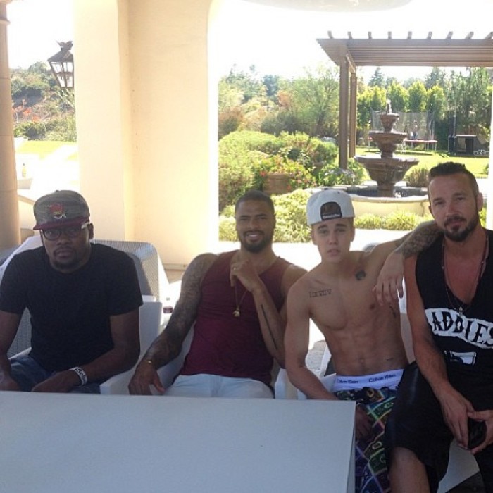 Justin Bieber shared a photo on Instagram of him 'chilling' with Tyson Candler (on Bieber's immediate right), Kevin Durant and Carl Lentz (on Bieber's left).