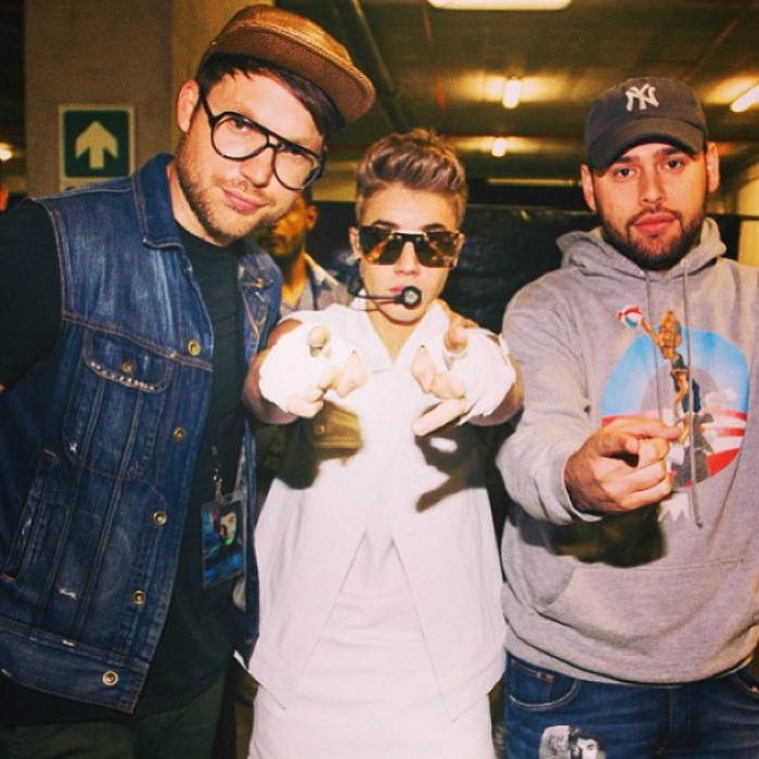 Justin Bieber's manager Scooter Braun shared a photo on Instragram of himself, Pastor Judah Smith and Justin Bieber.