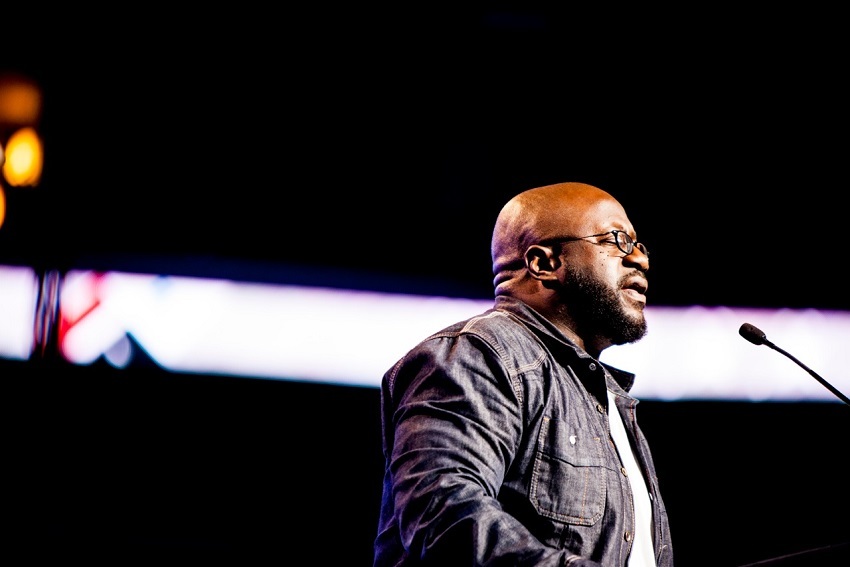 Pastor Eric Mason of Epiphany Fellowship in Philadelphia opens the first night of Harvest America in prayer, Sept. 28, 2013.