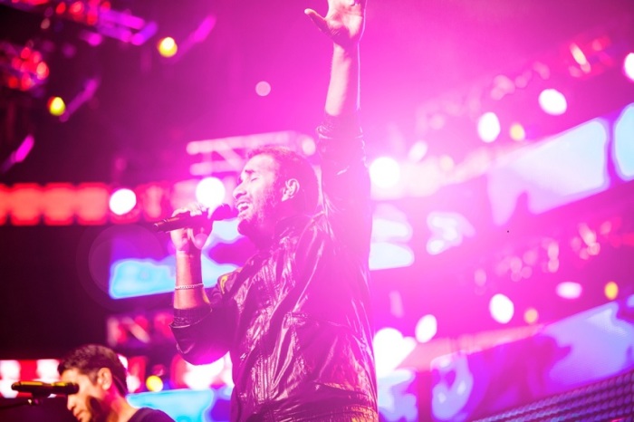 Member of the Katinas leads crowd in worship music at Harvest America, Sept. 28, 2013.