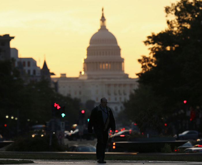The United States Capitol dome is seen down Pennsylvania Avenue in Washington September 30, 2013. With a deadline to avert a federal government shutdown fast approaching, the U.S. Capitol was eerily quiet on Sunday as Republicans and Democrats waited for the other side to blink first and break the impasse over funding.