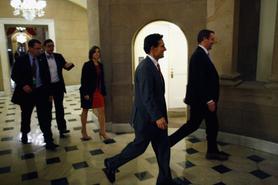 U.S. House Majority Leader Eric Cantor (R-VA) (C) walks into the offices of Speaker John Boehner (R-OH) (not pictured) during a rare late-night Saturday session at the U.S. Capitol in Washington, September 28, 2013.