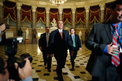 U.S. House Speaker John Boehner (R-OH) (C) walks to the floor of the Republican-controlled House to vote for budget legislation, including measures meant to weaken the Affordable Care Act (known as Obamacare), to send it to the Democratic-controlled Senate during a late-night budget showdown at the U.S. Capitol in Washington September 30, 2013. The House passed the measure and sent it to the Senate where new Obamacare provisions included in the bill are expected to be killed.
