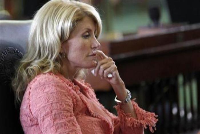 Democrat Texas State Sen. Wendy Davis listens as the state Senate meets to consider legislation to regulate abortion clinics in Austin, Texas, on July 12, 2013.