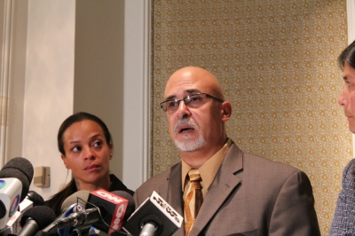 Pastor Edwin Mieses Sr. talks about his son Edwin Mieses Jr. at a press conference in Manhattan N.Y. on Friday. The mother of his son's two children Dayana Mejia (l) looks on.