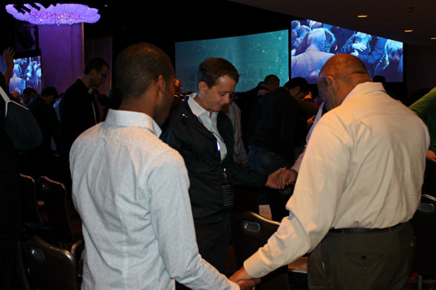 Christian pastors, ministry leaders, and professionals gathered at the Marriott Marquis Thursday, Oct. 10, 2013, in New York City for the fourth annual Movement Day. In this photo, participants were asked to join in small groups to pray.