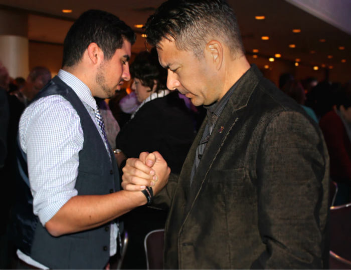 Christian pastors, ministry leaders, and professionals gathered at the Marriott Marquis Thursday, Oct. 10, 2013, in New York City for the fourth annual Movement Day. In this photo, two gentleman join others in pairing up to pray.
