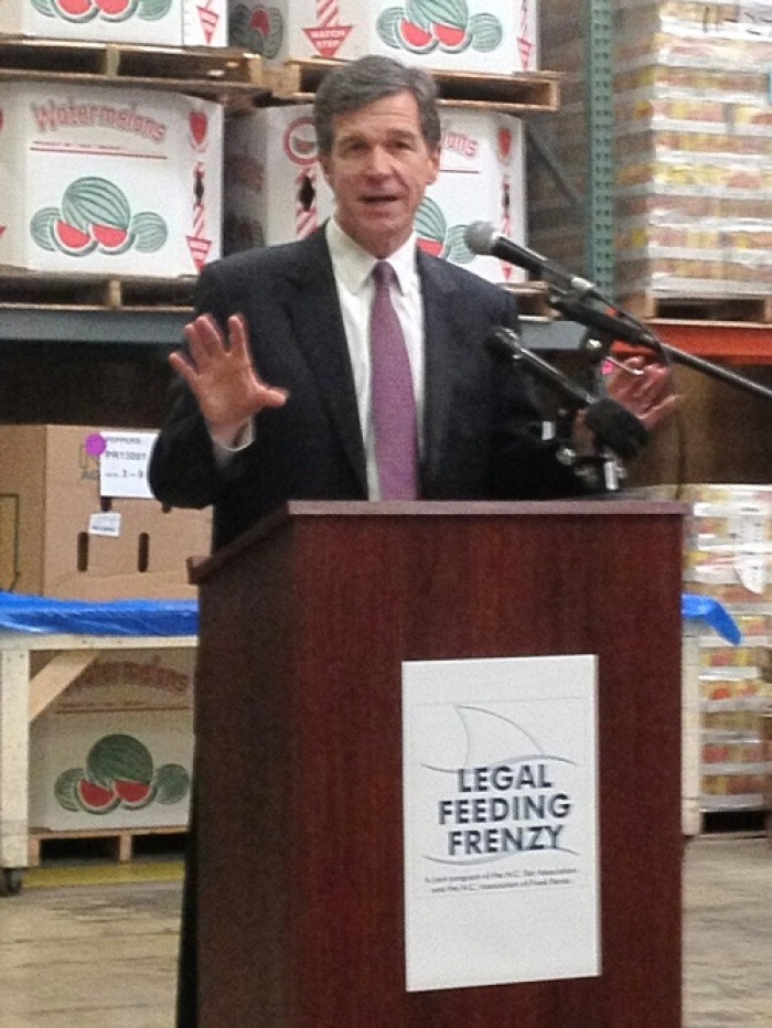 North Carolina's Attorney General Roy Cooper speaking at an event for the North Carolina Bar Association's Legal Feeding Frenzy event.
