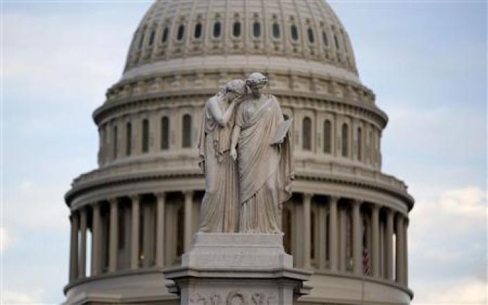 The statue of Grief and History stands in front of the Capitol Dome in Washington October 15, 2013.