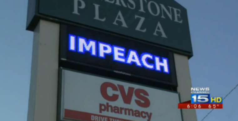 A two-day video billboard ad campaign paid for by LaRouche PAC was removed from Kendallville, Ind., shopping center. The billboard, which read 'impeach Obama,' also shows an image of President Barack Obama with an Adolf Hitler mustache, Oct. 14, 2013.