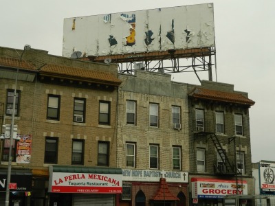 This photo shows where the billboard that formerly contained an advertisement for a New York City strip club stands in relation to New Hope Baptist Church in Queens.