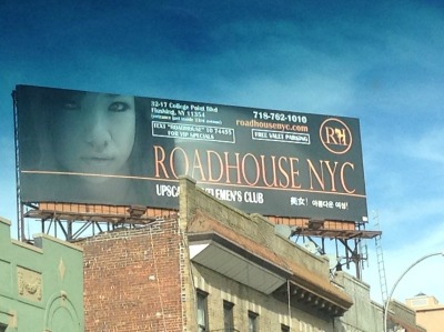 This billboard advertisement for Roadhouse NYC strip club was formerly located over a storefront church in Queens but has been removed.