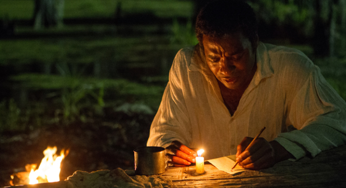 Lead character Solomon Northup (Chiwetel Ejiofor) tries writing a letter to his family in New York to rescue him from a Louisiana plantation where he is being held as a captive in Steve McQueen's '12 Years a Slave.'