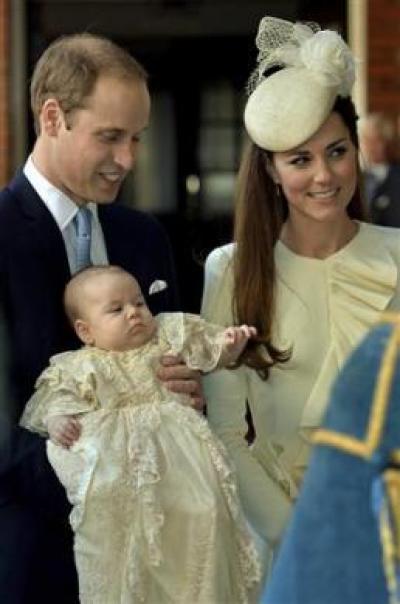 Britain's Prince William carries his son Prince George, as he arrives with his wife Catherine, Duchess of Cambridge for their son's christening at St James's Palace in London October 23, 2013.