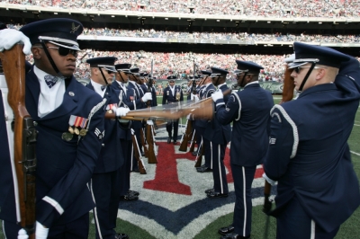 The Air Force Honor Guard Drill Team performs at halftime of an NFL game in 2009.