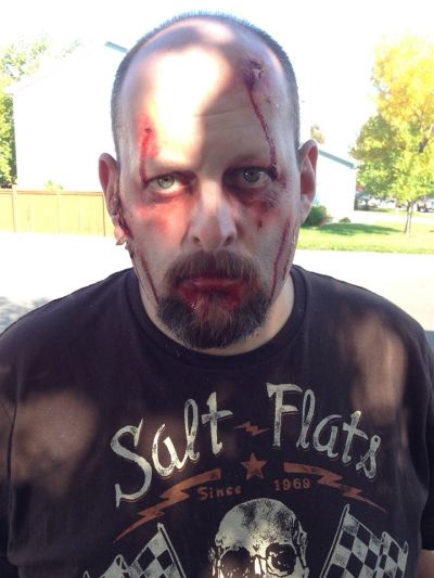 Colorado police officer Jeremy Yachik seen here in Halloween make-up is accused of child abuse.