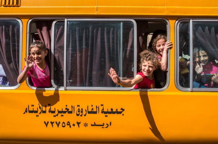 After an afternoon of reading, writing and math, scores of children head to their families in host communities in Jordan, where World Vision funds a remedial school for 200 Syrian and Jordanian children. The organization also pays for transportation. (World Vision)