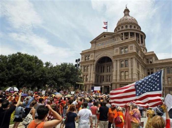 Protesters rally before the start of a special session of the Legislature in Austin, Texas, July 1, 2013.