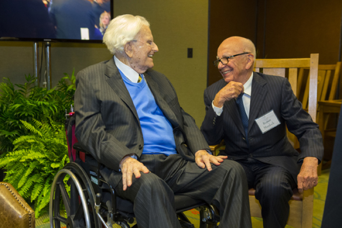Billy Graham catching up with his longtime friend, Rupert Murdoch.