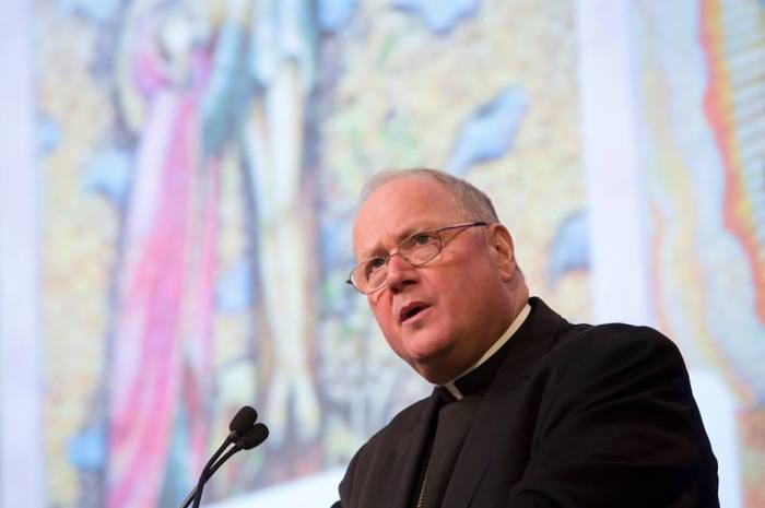 New York Cardinal Timothy M. Dolan, president of the U.S. Conference of Catholic Bishops, addresses the annual fall meeting of the bishops Nov. 11 in Baltimore.