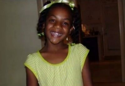 Ten-year-old Emani Moss's burned body was found in a trash can on Nov. 2. Her father and step-mother have been charged in her death.