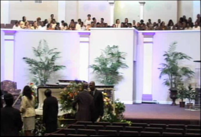 Mourners view the body of Pastor Teddy Parker Jr. at his funeral held at Fellowship Bible Baptist Church in Warner Robins, Ga., on Saturday November 16, 2013.