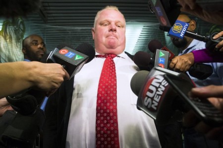 Toronto Mayor Rob Ford talks to reporters after admitting to smoking crack cocaine while being in a drunken stupor, the act of which has been circulated in a viral video.