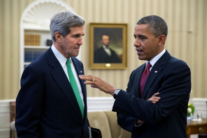 President Barack Obama talks with Secretary of State John Kerry in the Oval Office, Nov. 1, 2013.