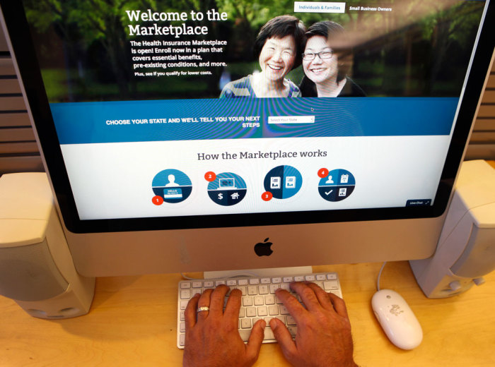 A man looks over the Affordable Care Act (commonly known as Obamacare) signup page on the HealthCare.gov website in New York in this October 2, 2013 photo illustration. The federal government's portal logged over 2.8 million visitors by afternoon October 2, largely in an attempt to sign up for Obamacare.