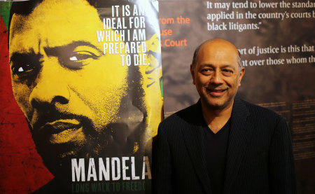 Film producer Anant Singh poses for photographs during the launch of the movie trailer of "Mandela: Long Walk to Freedom" at the Nelson Mandela Centre of Memory in Johannesburg, September 17 2013.
